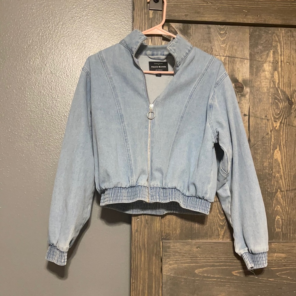 Light wash bomber style denim jacket. Slightly worn.